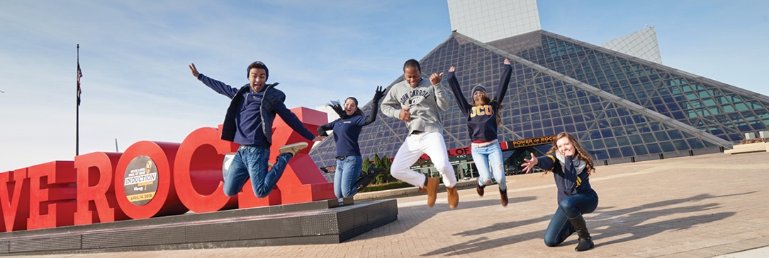 ִ˰appԼ students jumping in front of 'WE ROCK" sign